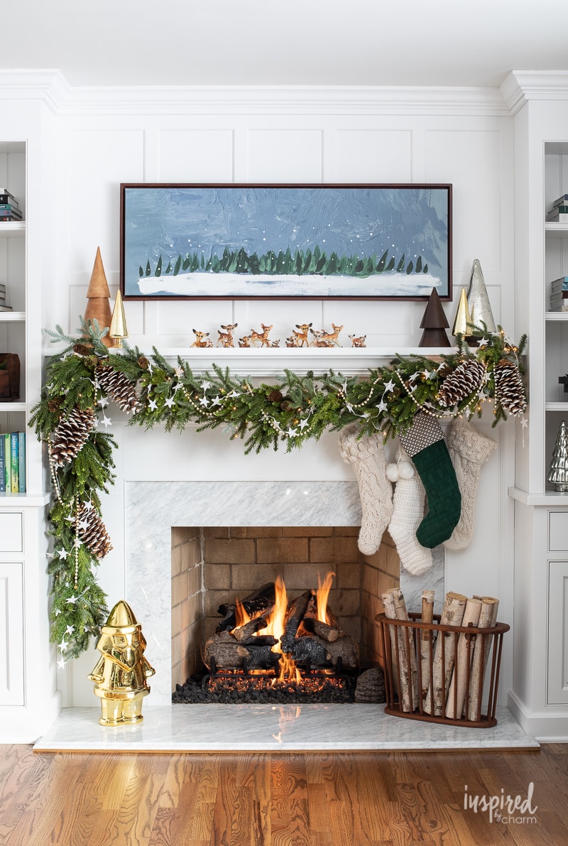 Living Room Christmas Mantel Decor #livingroom #mantel #christmas #fireplace #holiday #decor #bookshelf #bookcase #garland