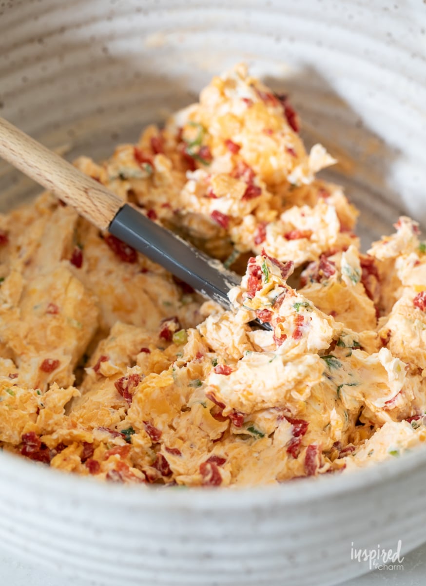 mixed up cheese ball ingredients in a bowl. 