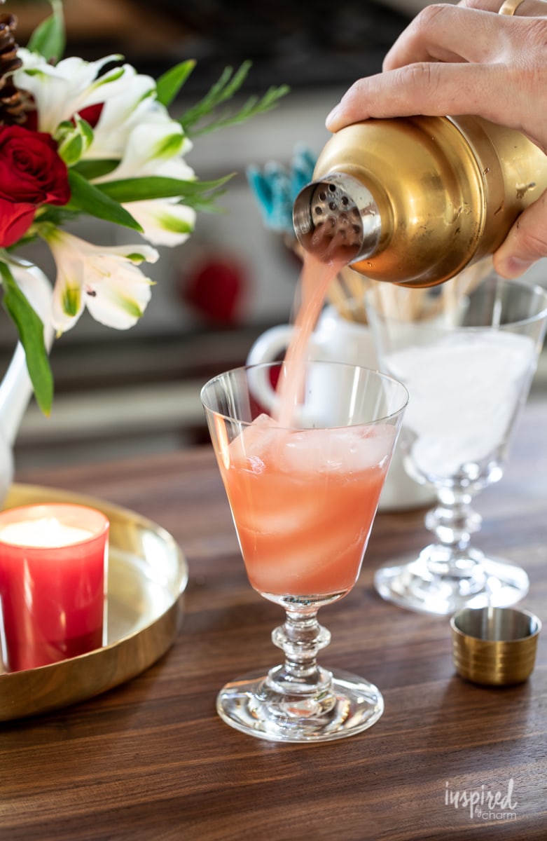 Pouring a cocktail into a glass