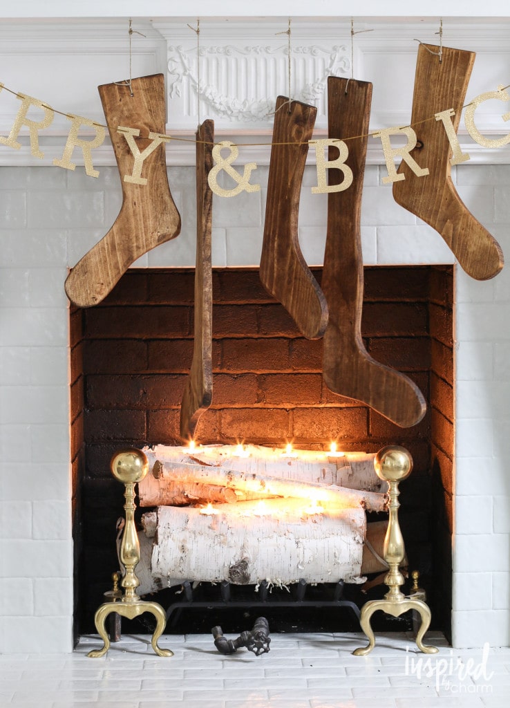 Antique Wood Stockings hung on a Christmas mantel.