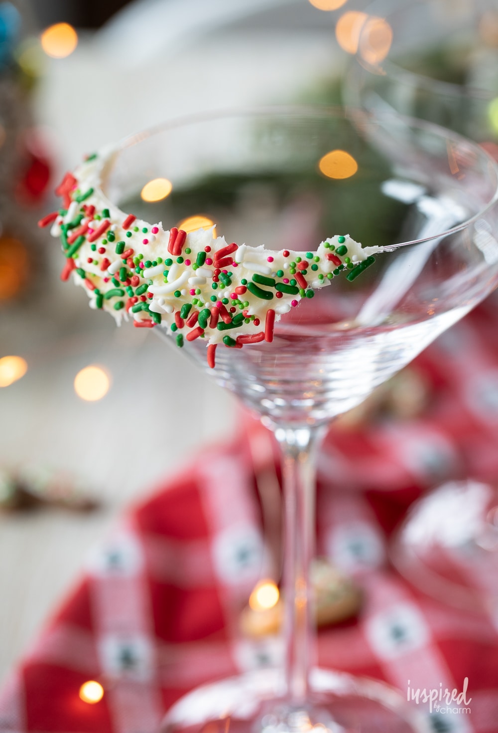 martini glass with frosting and sprinkle garnish. 