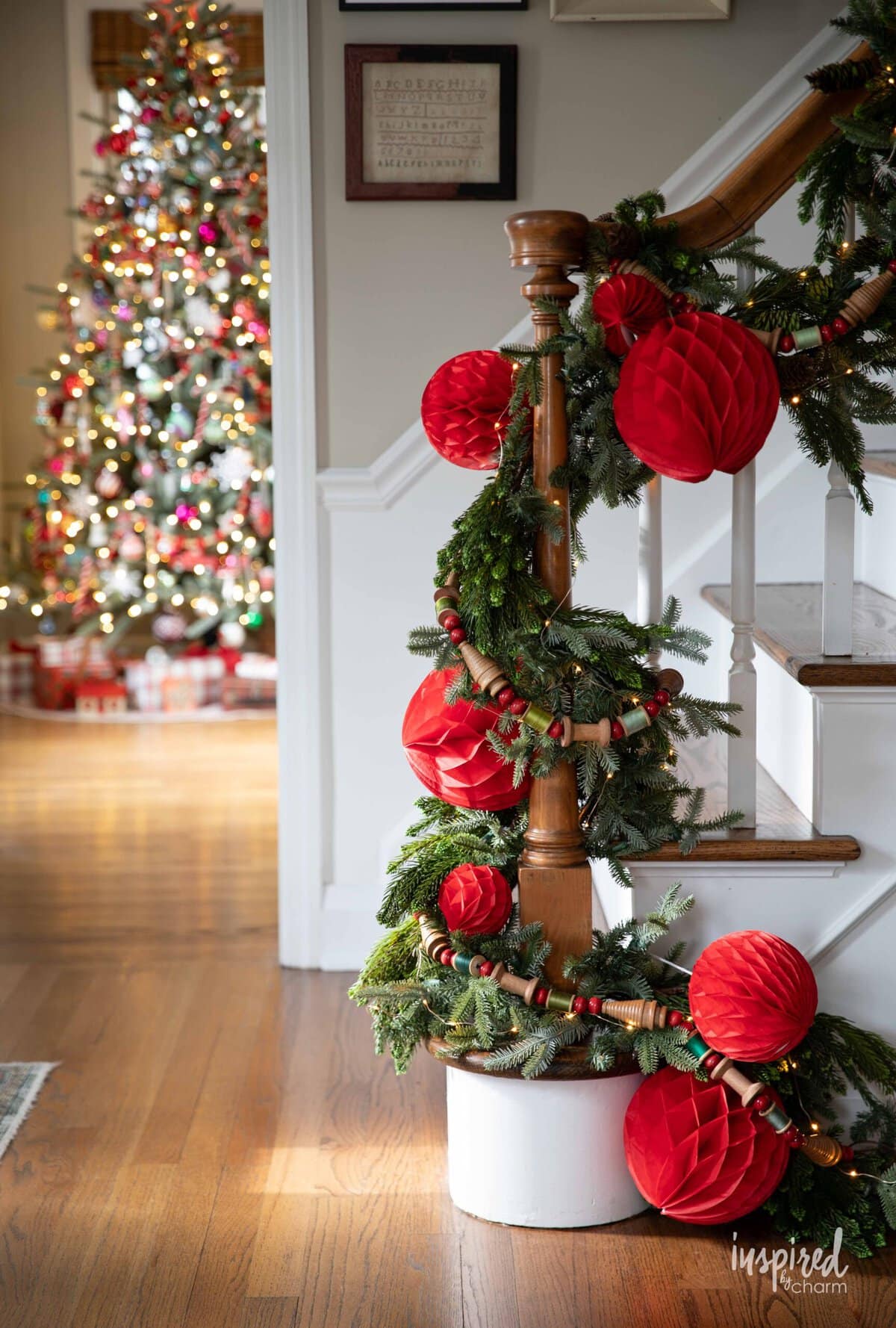 staircase garland with paper balls and vintage bobbin garland.