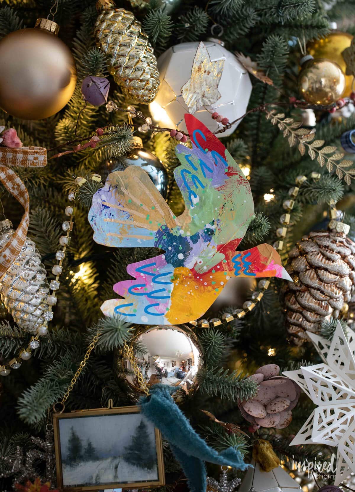 colorful painted dove on a Christmas tree.