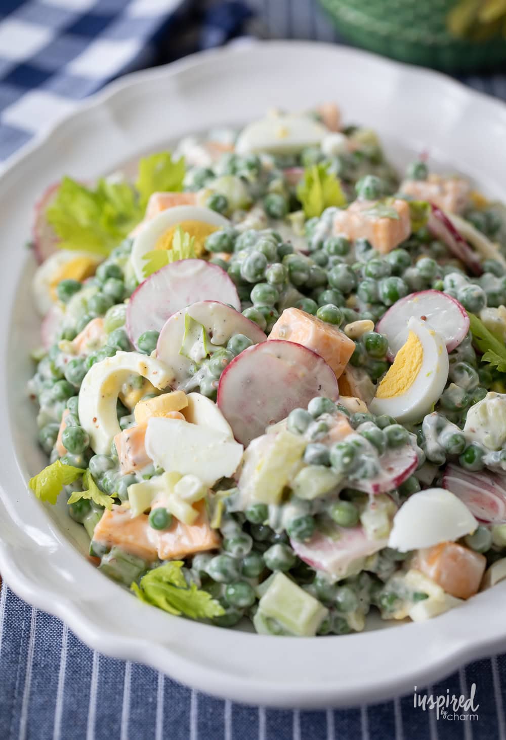 Cheese and Pea Salad on a white oval platter.