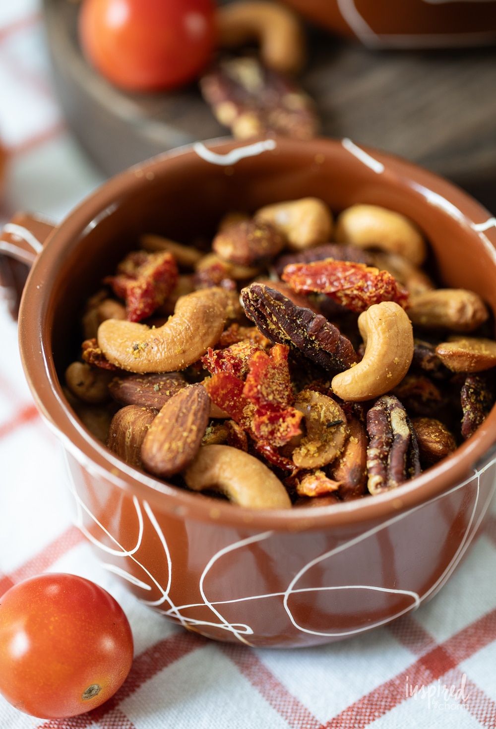 vintage enamel mug filled with homemade pizza trail mix.