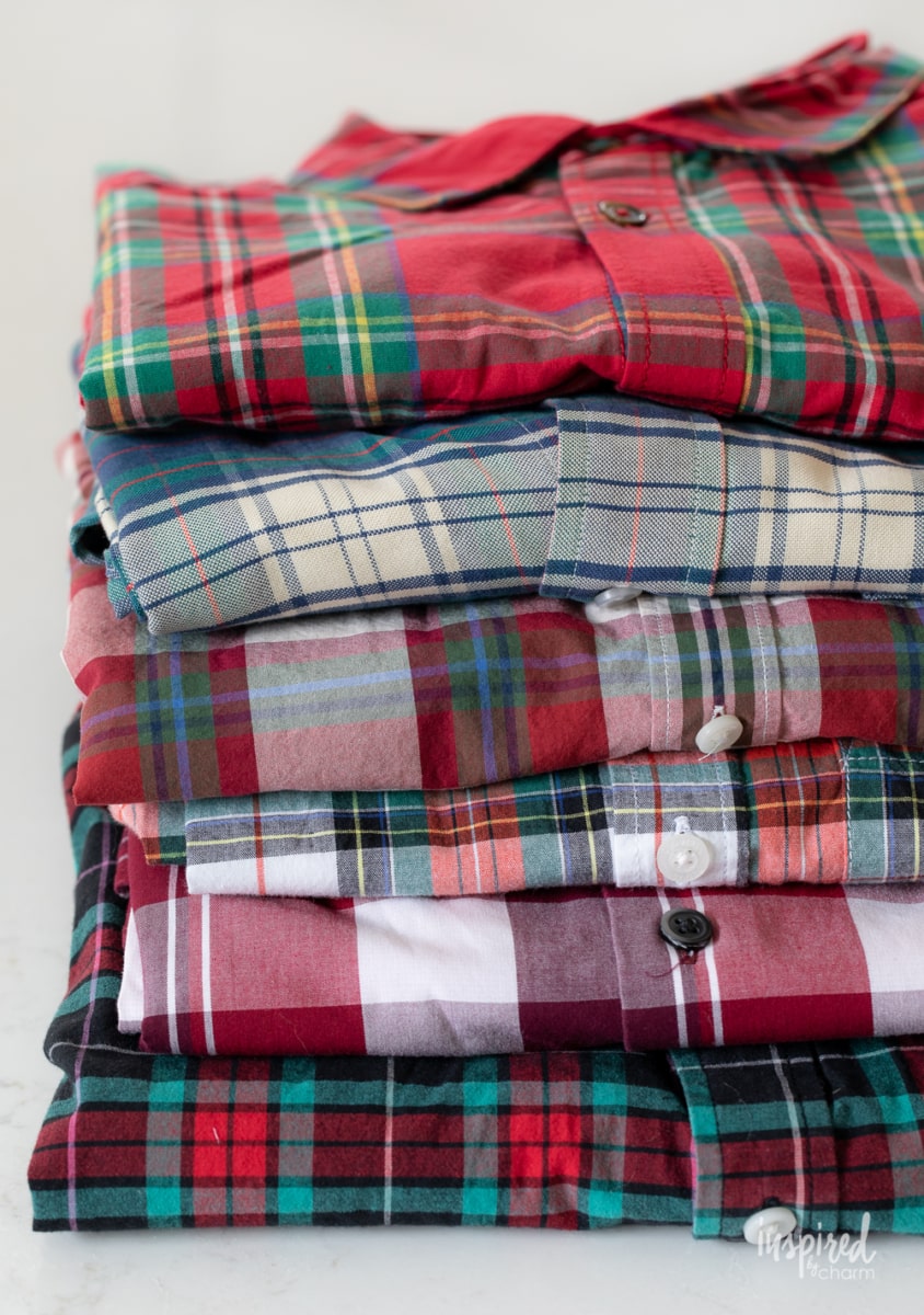 stack of folded plaid button down shirts.