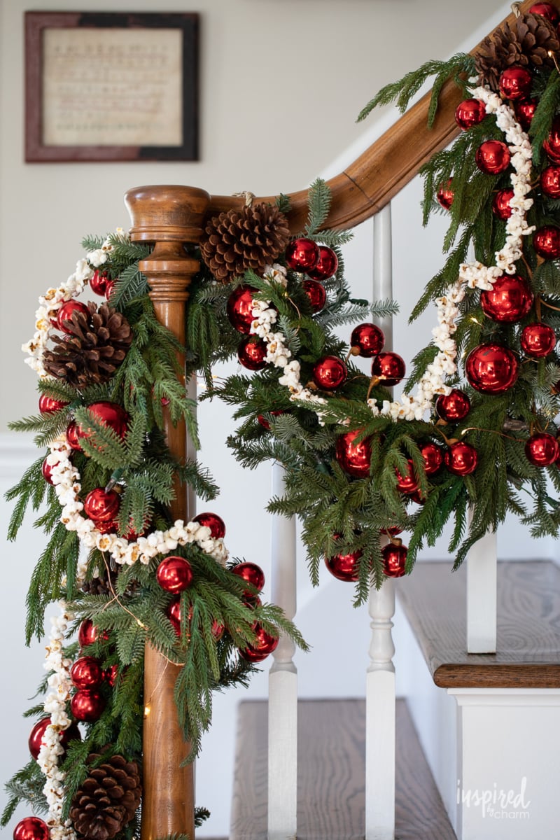 popcorn garland on pine garland on banister.