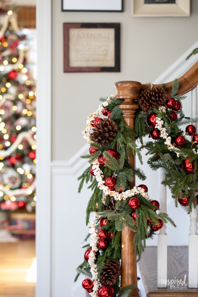 popcorn garland on pine garland on banister.