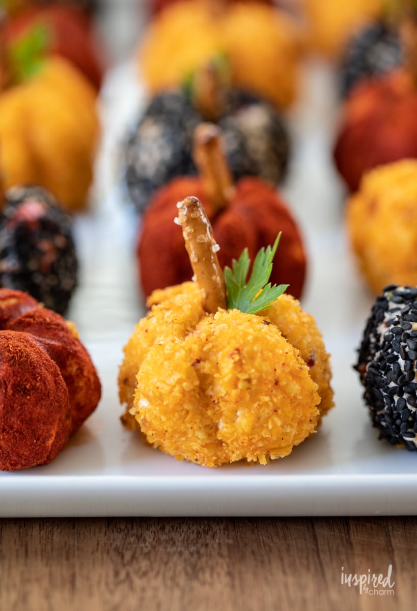 spread of Mini Pumpkin Cheese Balls on a plate.
