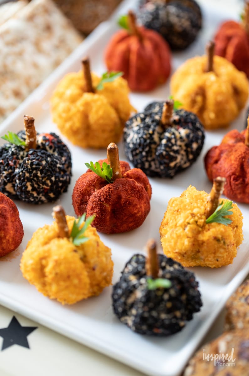 array of Mini Pumpkin Cheese Balls  on a plate.
