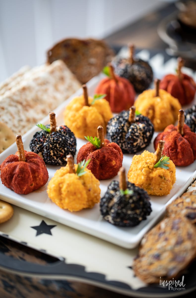 crackers served with Mini Pumpkin Cheese Balls on a platter. 