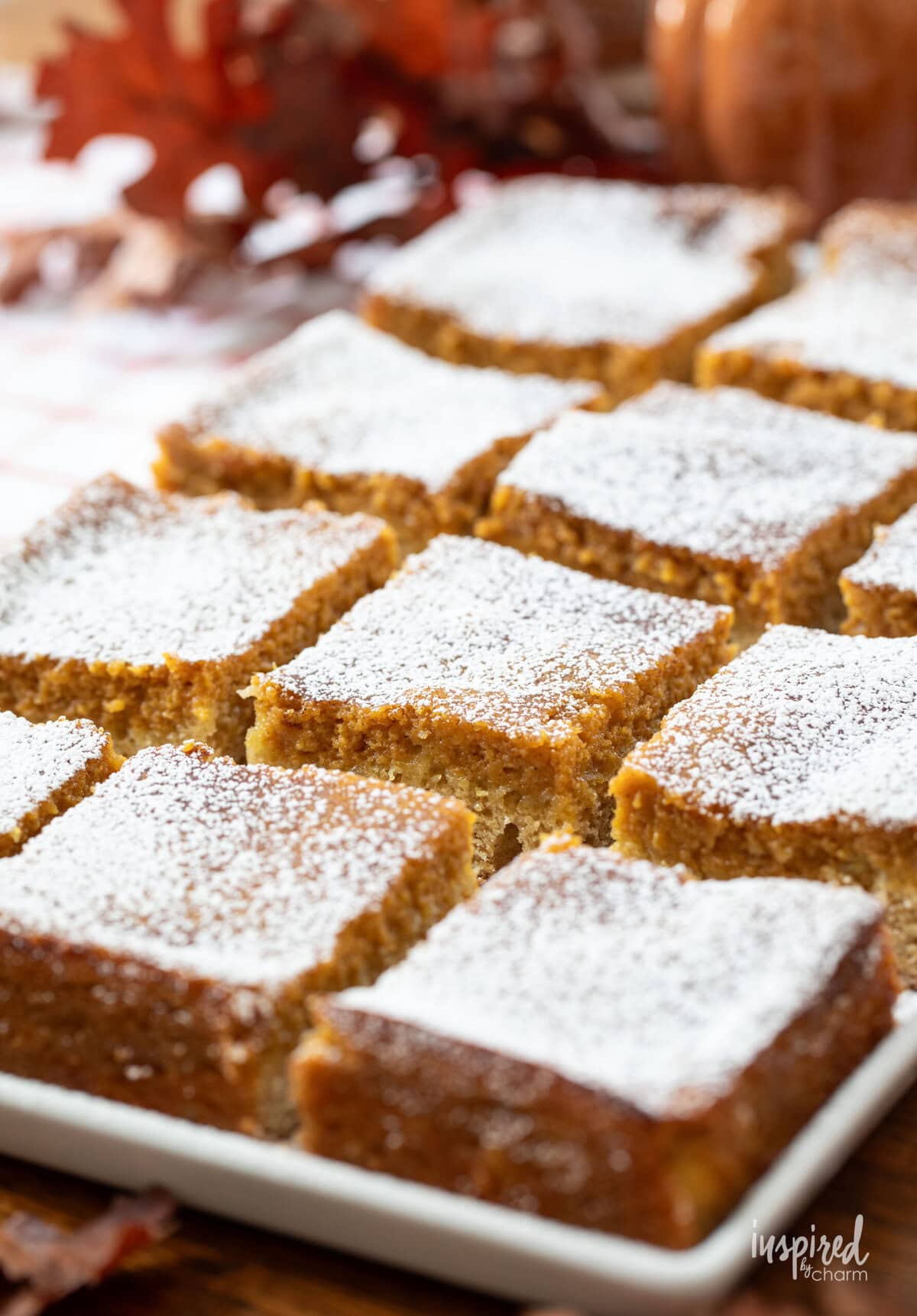 Pumpkin Pie Cake Bars served on a white plate with napkins.