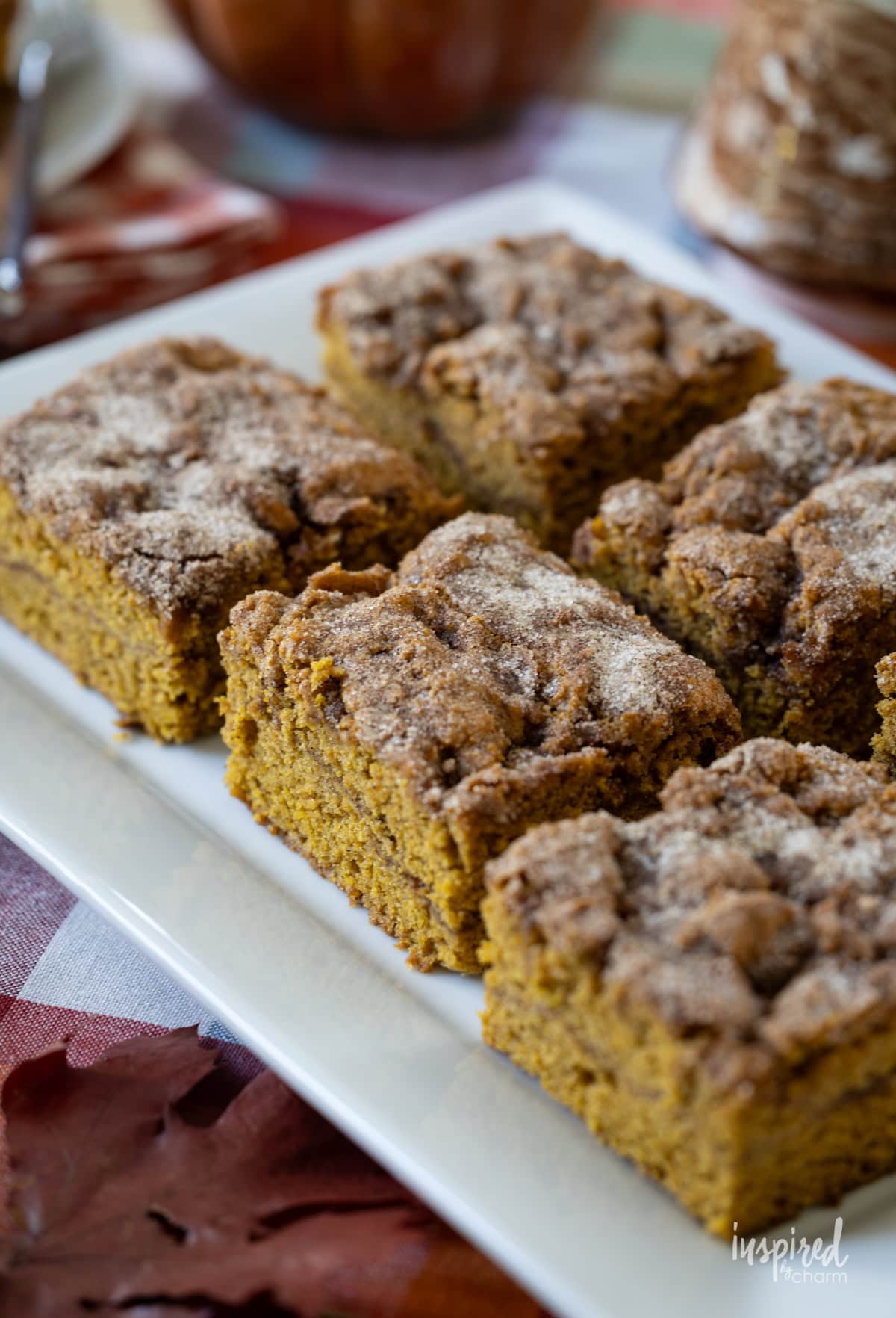 Pumpkin Snickerdoodle Cake on a white platter.