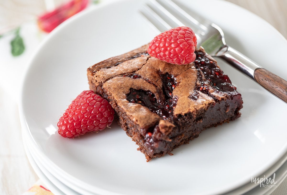 Raspberry Brownie on a plate with fork.