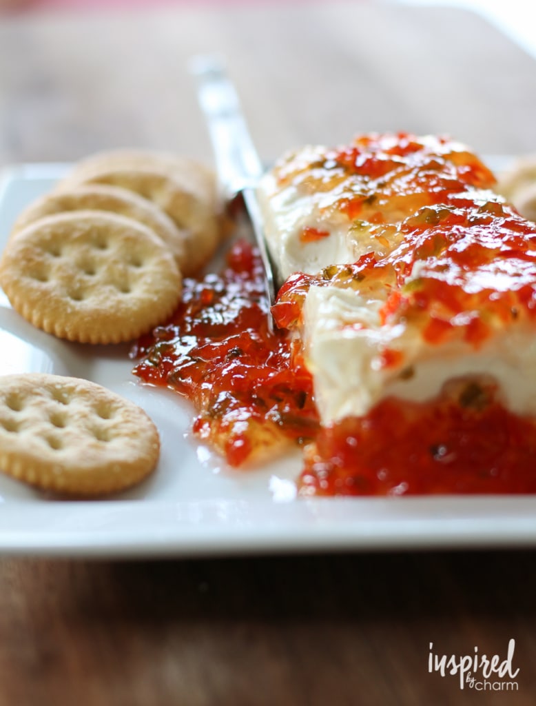 block of cream cheese covered in pepper jelly