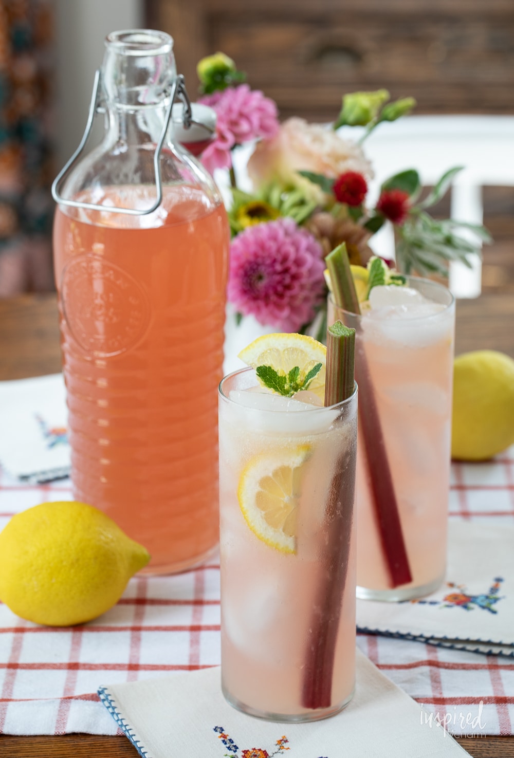 bottle of rhubarb ginger vodka with two cocktails.