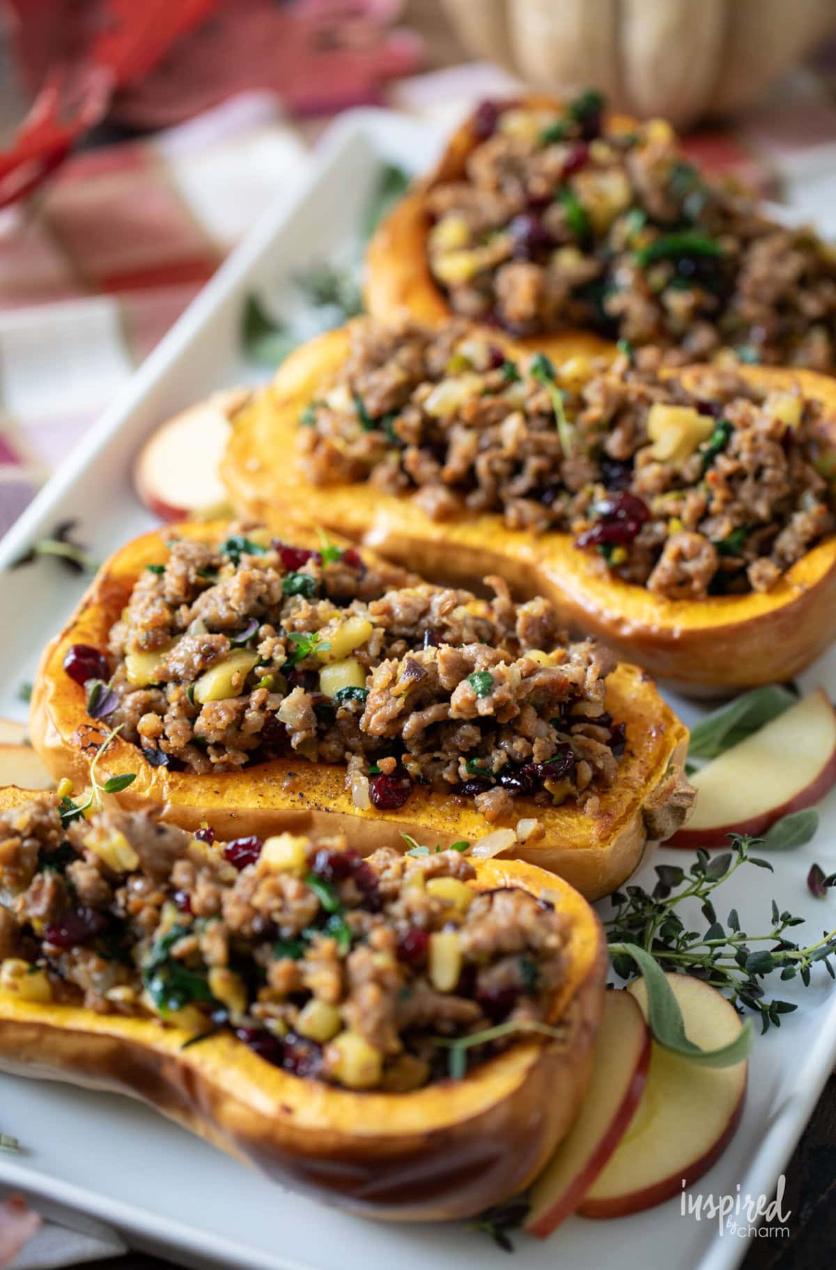 four Roasted Butternut Squash halves filled with sausage.
