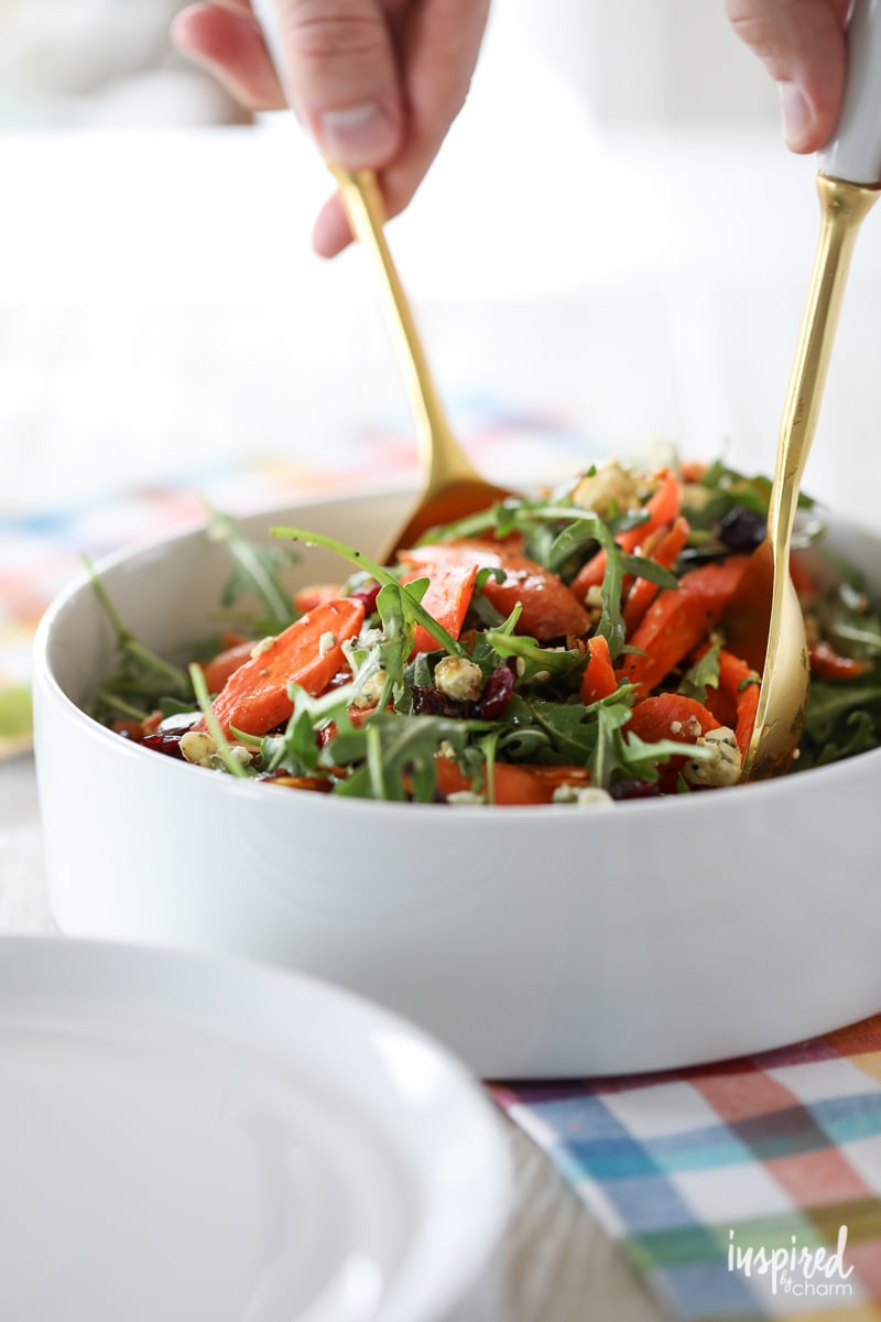 Learn how to make this delicious roasted #carrot #salad #recipe with arugula, blue cheese, dried cranberries, and almonds. 