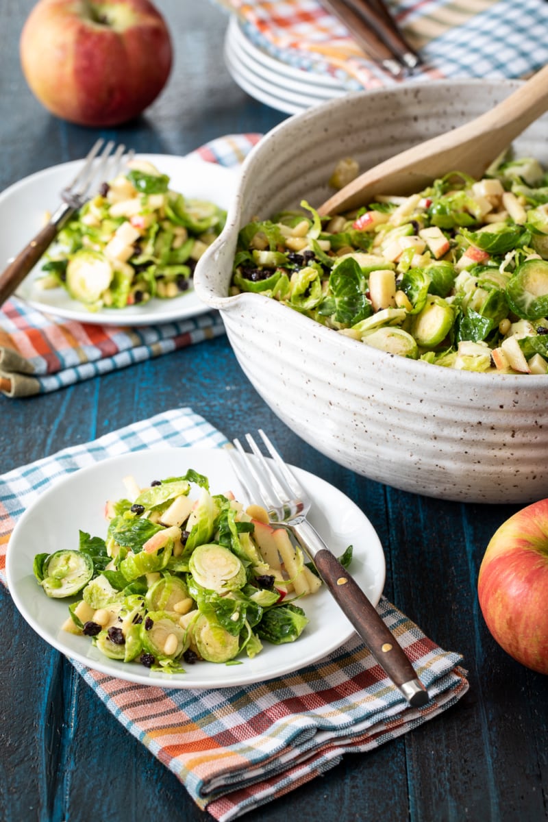 Shaved Brussels Sprout Salad in a bowl and served on small plate.