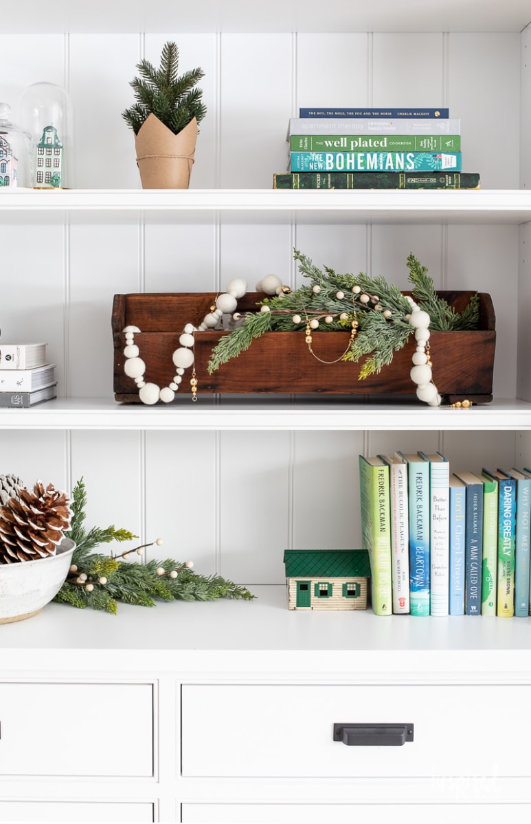 Living Room Christmas Mantel Decor #livingroom #mantel #christmas #fireplace #holiday #decor #bookshelf #bookcase #garland