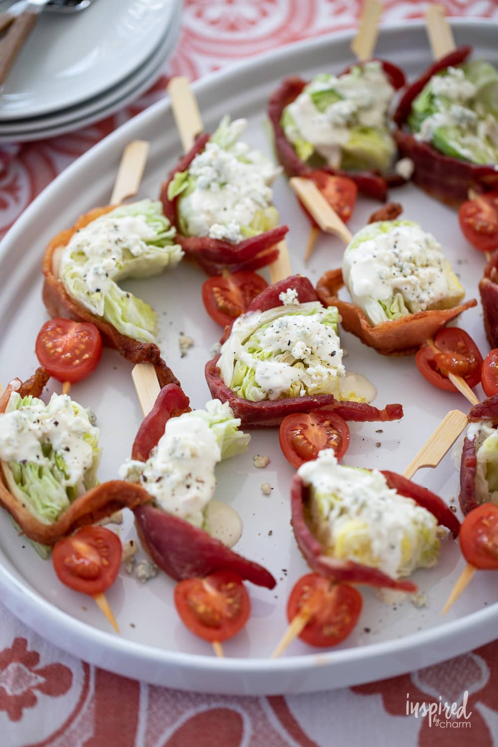 wedge salad skewers on a platter.