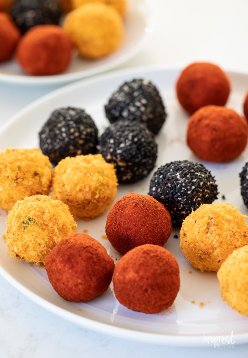 Cheese balls coated in different toppings.