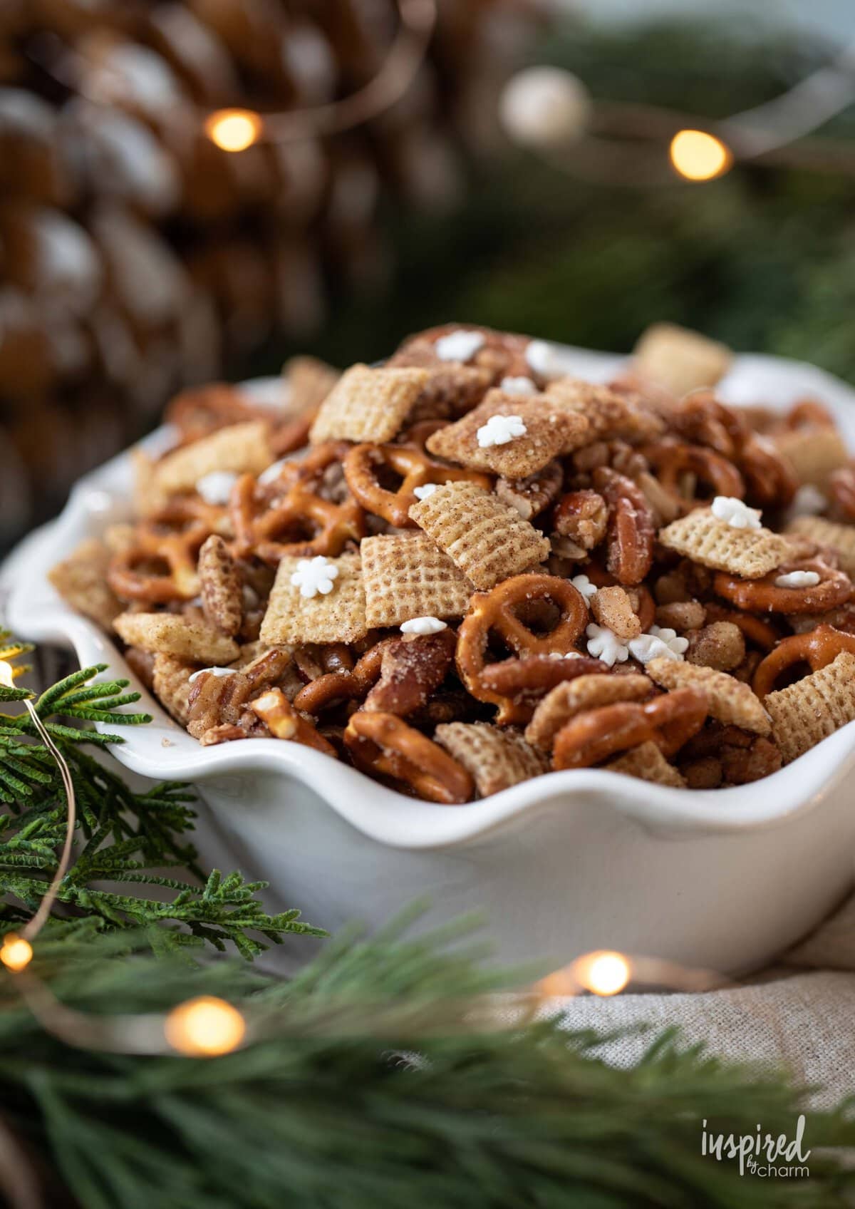 Snickerdoodle Chex Mix served in a white fluted bowl.