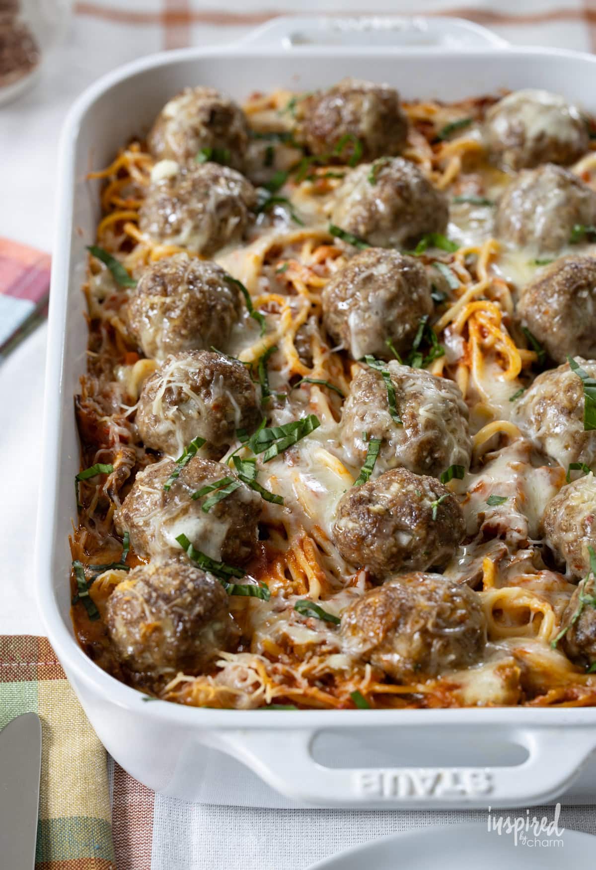 Spaghetti and Meatballs Casserole in a large white baking dish.