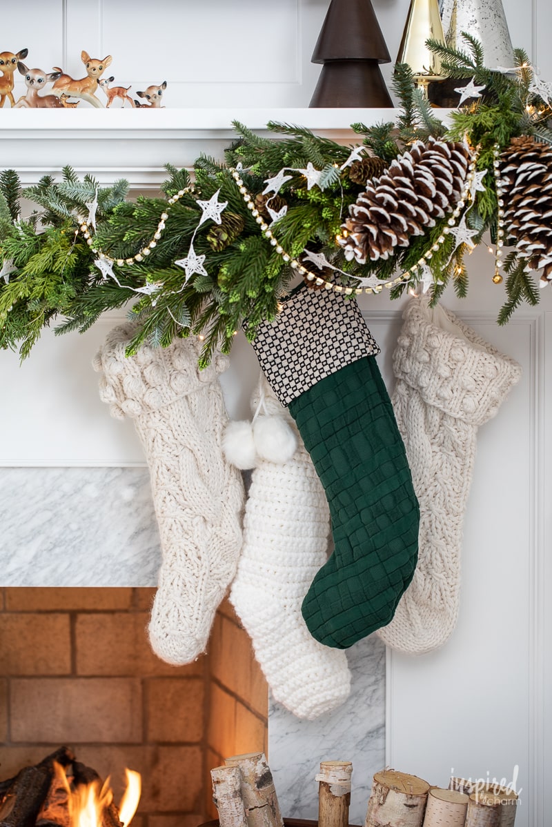 Living Room Christmas Mantel Decor #livingroom #mantel #christmas #fireplace #holiday #decor #bookshelf #bookcase #garland