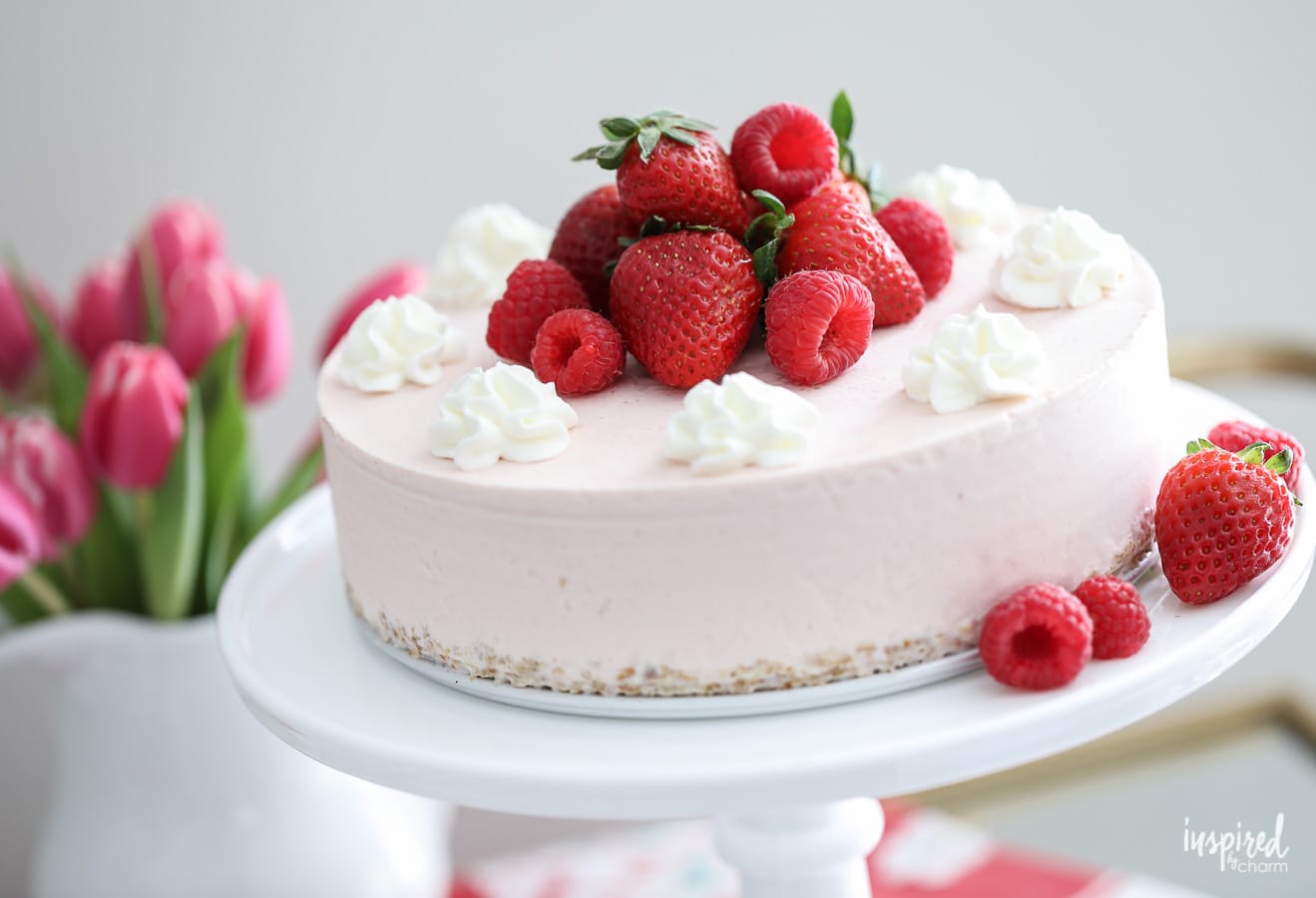 This Strawberry Ice Cream Cheesecake is a delicious summer dessert recipe. #summer #strawberry #cake #cheesecake #icecream #recipe #dessert