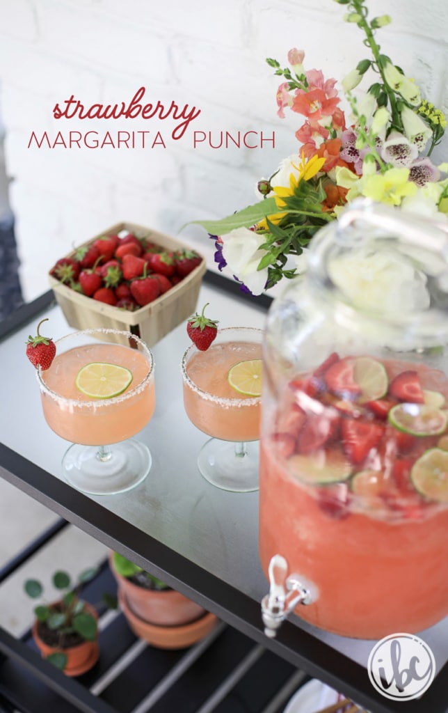 Strawberry Margarita Punch in glasses and beverage dispenser. 