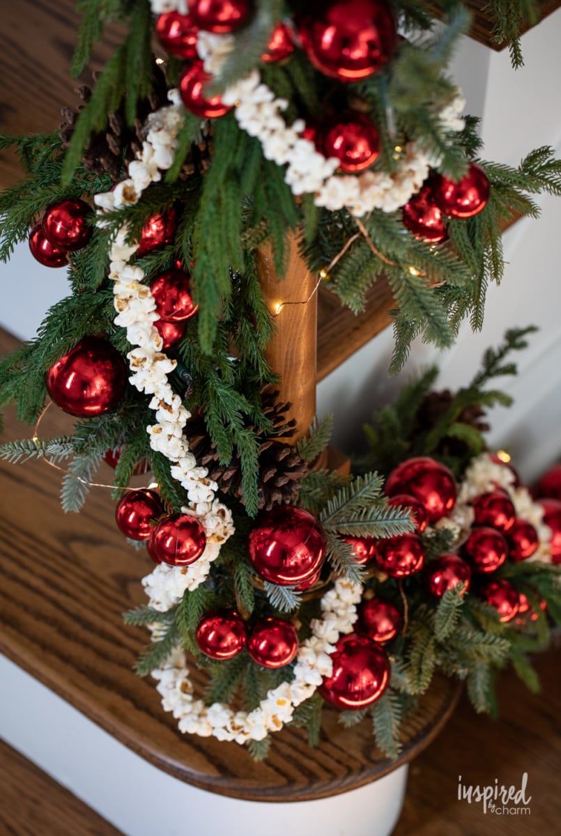 popcorn garland on pine garland on banister.