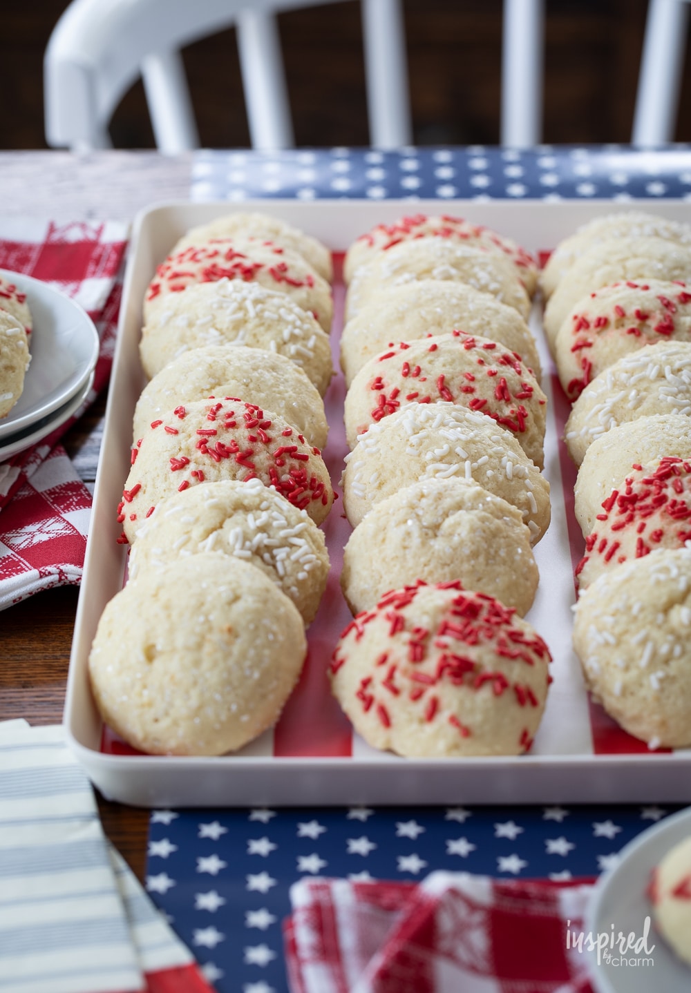 sugar cakes with colorful sprinkles on a plate.