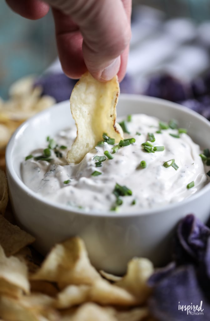 potato chip scooping up chip dip