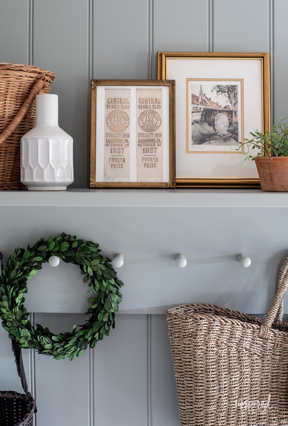 shelf with pegs painted with farrow and ball pigeon.