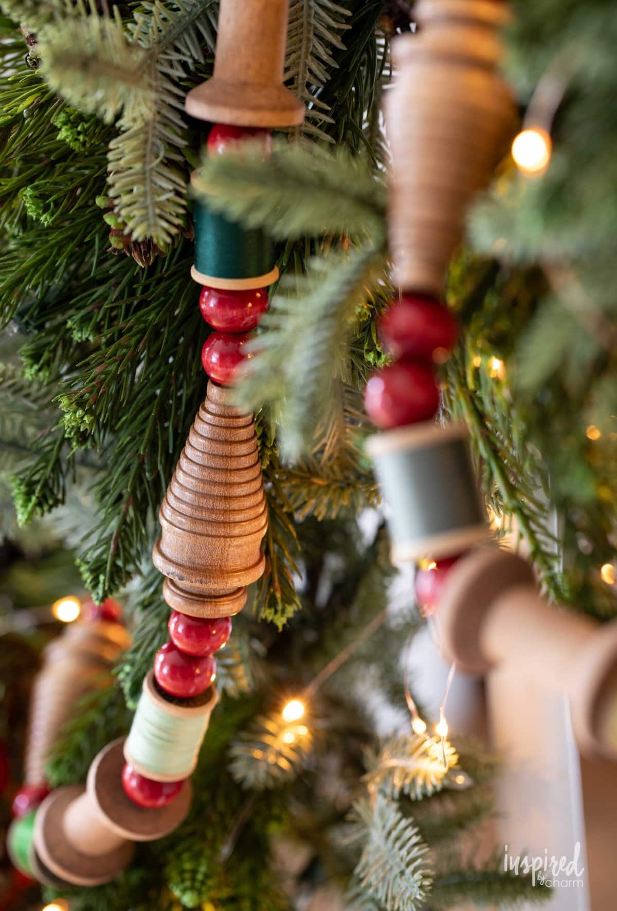 Vintage Bobbin Christmas with green thread and red beads.