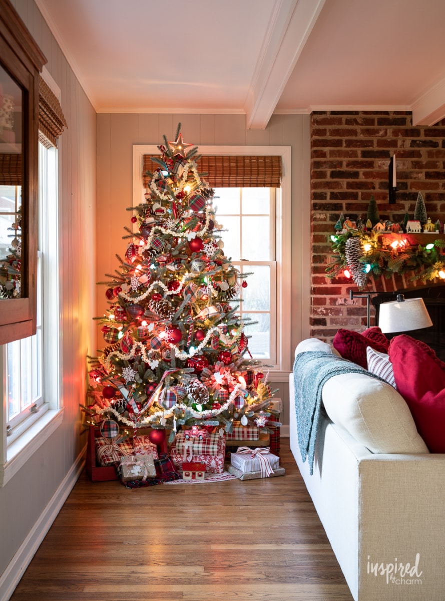 christmas tree with colored lights in living room.
