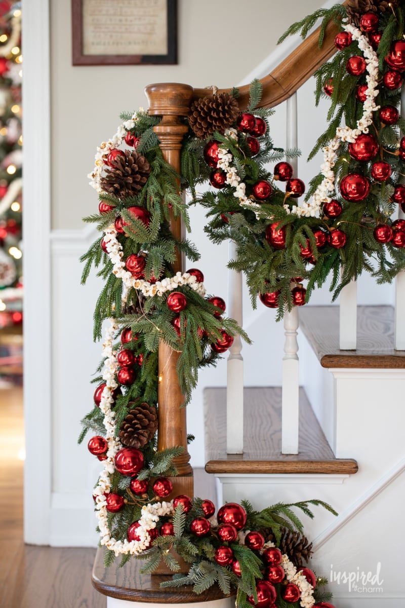 popcorn garland on pine garland on banister.