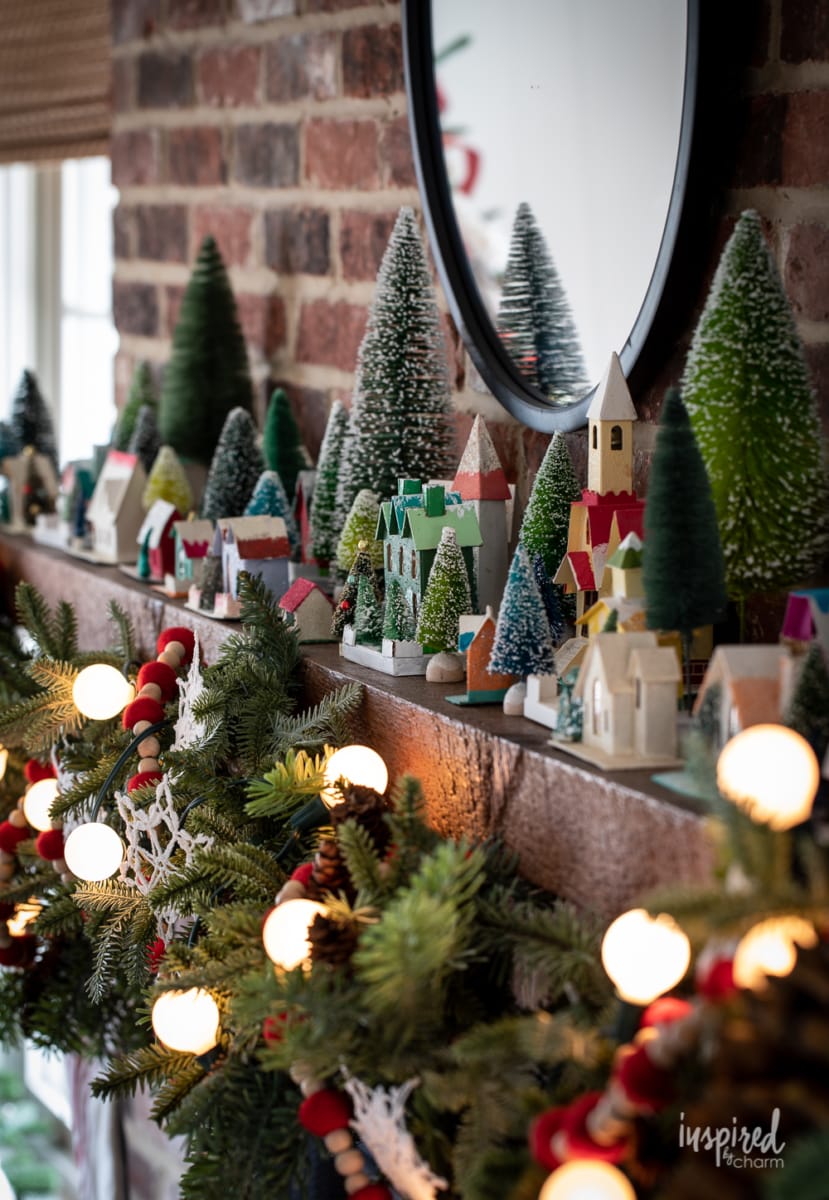 Putz House Christmas Mantel and festive garland. 