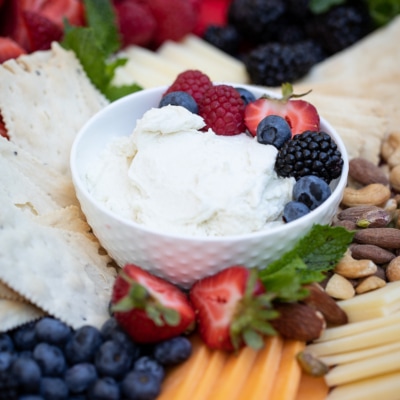 whipped honey goat cheese spread in bowl.