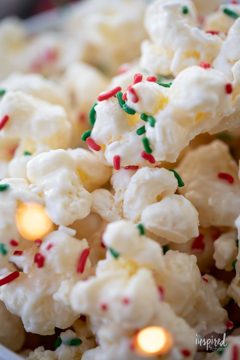 close up of White Chocolate Puff Corn with sprinkles.