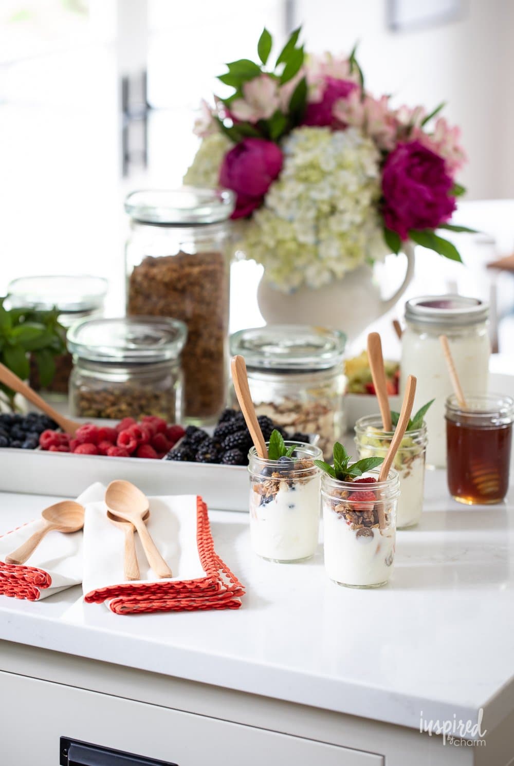 yogurt parfaits and granola bar on counter.